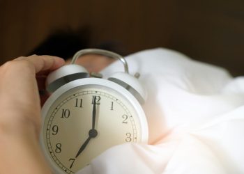 Photo of Person Holding Alarm Clock