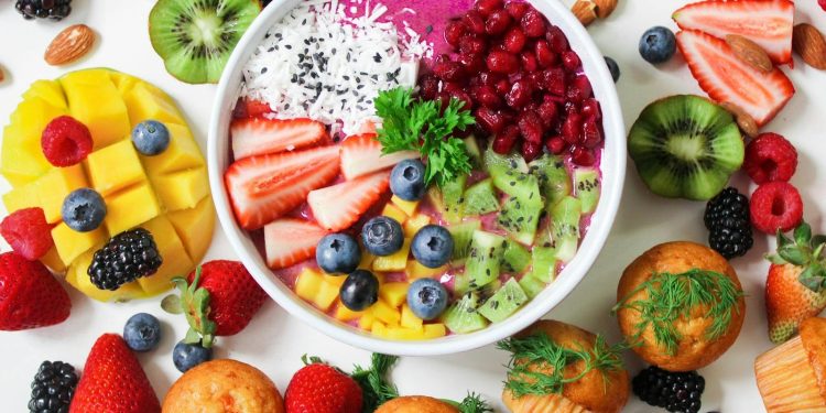 Assorted Sliced Fruits in White Ceramic Bowl