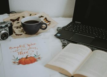 Cup of Coffee Near Laptop Computer