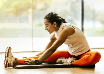 Woman Stretching on Ground