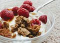 Delicious Greek yogurt with biscuit crumb and fresh raspberries