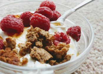 Delicious Greek yogurt with biscuit crumb and fresh raspberries