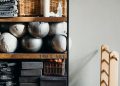 White Ceramic Vase on Brown Wooden Shelf