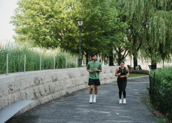 Woman and Man Jogging in Park