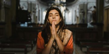 Woman Praying inside the Church