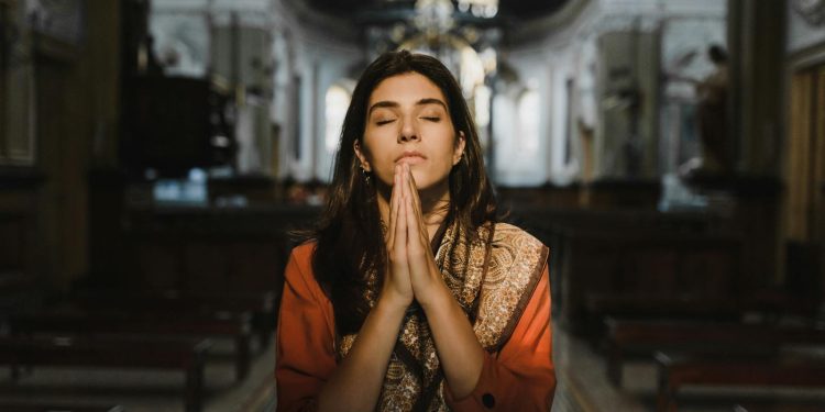 Woman Praying inside the Church