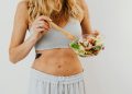 Toned Woman Eating Vegetable Salad