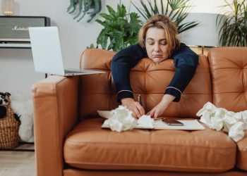 Woman Writing on a Notebook