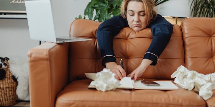 Woman Writing on a Notebook