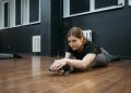 Woman in a Dance Studio Doing Leg Split