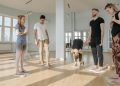 Group of People Meditating While Standing on Sadhu Boards