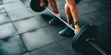 Person Holding Barbell