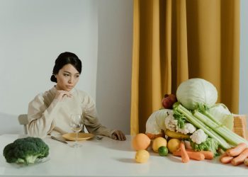 A Woman Looking at Assorted Vegetables