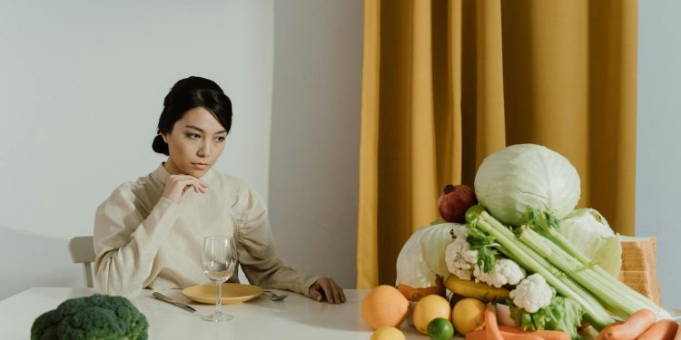 A Woman Looking at Assorted Vegetables