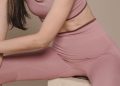 Photo of a Woman Wearing a Pink Sports Bra and Pink Leggings