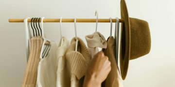 Hanging of Clothes on a Clothing Rack
