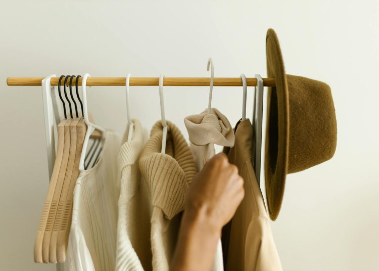 Hanging of Clothes on a Clothing Rack