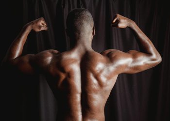 Shirtless Man With Muscular Body Flexing His Muscles