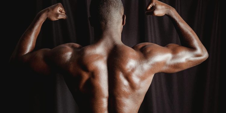 Shirtless Man With Muscular Body Flexing His Muscles